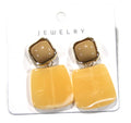 CONTEMPORARY AMBER BUTTERY YELLOW & CREAM RESIN DANGLE PIERCED EARRINGS